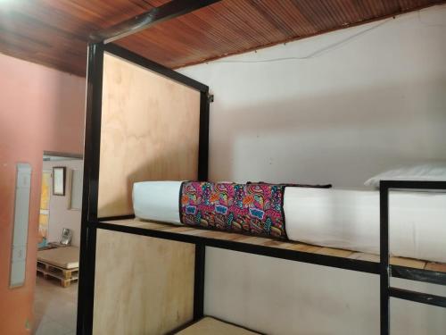 a room with two bunk beds on a shelf at Backpackers And Travellers Hostel in Neiva