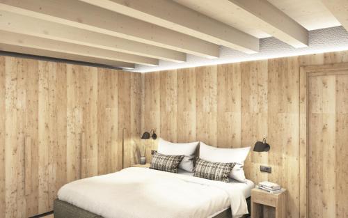 Ένα ή περισσότερα κρεβάτια σε δωμάτιο στο AlpeLuce Mountain Chalet