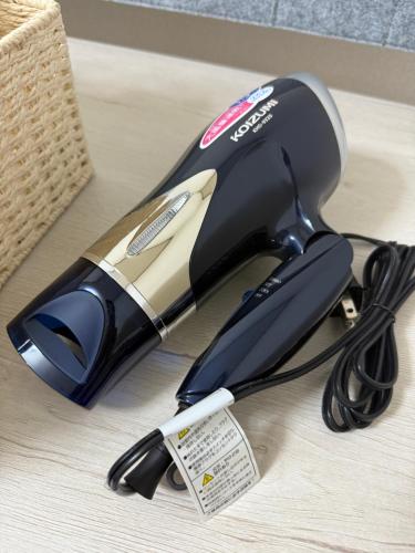a hair dryer sitting on top of a table at 折尾Inホテル305 in Kitakyushu