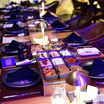 a long table with plates of food on it at Grand Sapphire 22 floor B BLock 377, Cypr Północny in Paralimni