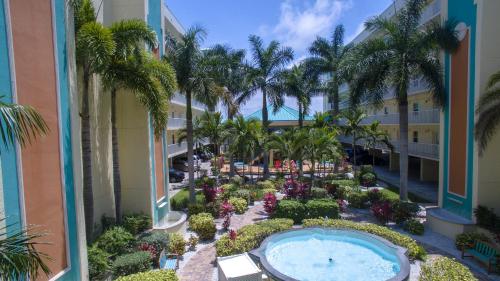 an aerial view of a resort with a swimming pool and palm trees at Winter Sale on Now-Sunset Vistas 303N 100s 5 stars in St Pete Beach