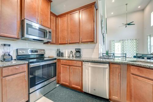 a kitchen with wooden cabinets and stainless steel appliances at Abi home in Brandon