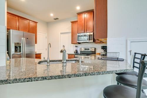 a kitchen with marble counter tops and wooden cabinets at Abi home in Brandon