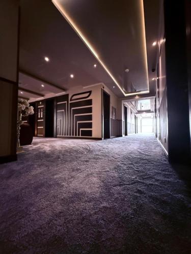 a large room with a large carpeted floor in a building at New Nairi Hotel Yerevan in Yerevan