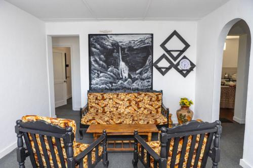 a dining room with a table and two chairs at Snowdon in Nuwara Eliya