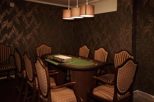 a dining room with a table and chairs at Harmónia apartman in Zánka