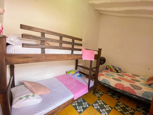 two bunk beds in a room with at CASA MAGIA by Magally Velasco in Curití