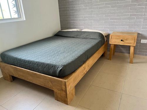 En eller flere senge i et værelse på Hermosa Casa en la Zona Industrial de Monterrey