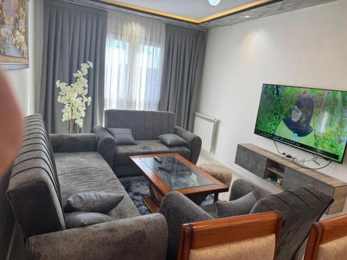 TV a/nebo společenská místnost v ubytování Résidence Bel Air