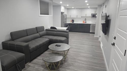 a living room with a couch and a table at Royaldee Cozy Home in Calgary