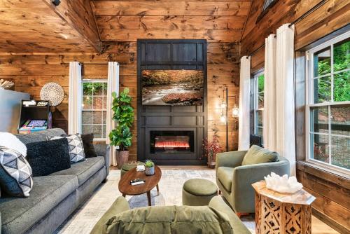 a living room with a couch and a fireplace at Romancing the Stone in Sevierville