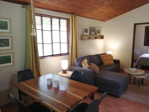 a living room with a couch and a table at Casa of Dreams in Dos Brazos