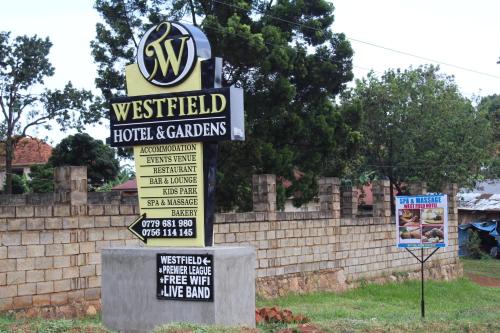 a sign for a westfield hotel and car dealers at WESTFIELD GARDENS and ACCOMODATION in Namulanda
