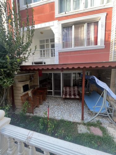 a building with a patio with a slide at Villa summer house for daily rent in a quiet location in Esenyurt