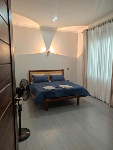 Ένα ή περισσότερα κρεβάτια σε δωμάτιο στο Hakuna Matata Apartment