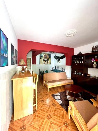 a living room with a couch and a table at Casa BB&Djassi - Rooms in Ponta do Sol