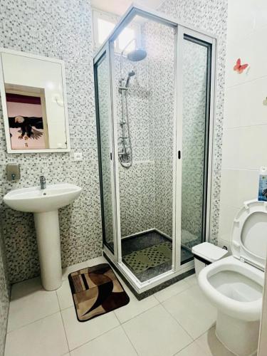 a bathroom with a shower and a sink and a toilet at Casa BB&Djassi - Rooms in Ponta do Sol