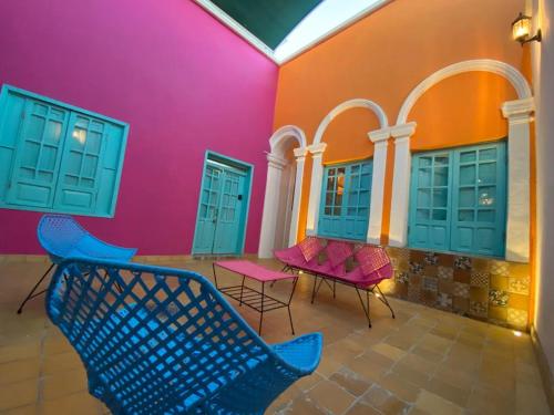 a patio with chairs and tables in a building at La Casa De Don Rámon in Guadalajara