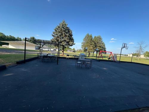 a park with benches and a playground at Skyview Motel - Prairie du Sac in Prairie du Sac
