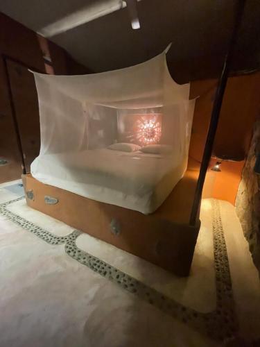 a room with a bed with a light in it at Villa Nanami in Arroyo Cruz