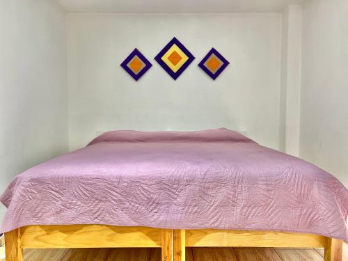 Hostal Amate Taxcoにあるベッド