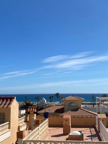 a view of the beach from the roof of a building at Suite solarium Km21 in Vera