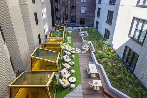 an overhead view of a rooftop garden on a building at Hotel Indigo Melbourne Little Collins in Melbourne
