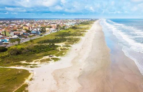 an aerial view of the beach in front of a city at Casa Brisa do Mar in Pontal do Paraná