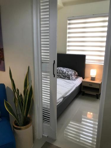 En eller flere senge i et værelse på Royal Garden Residences - Mabolo