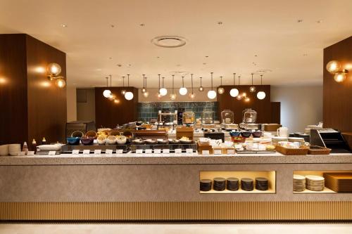 a large kitchen with aasteryasteryasteryasteryasteryasteryasteryasteryasteryasteryastery at Holiday Inn & Suites Sapporo Odori Park by IHG in Sapporo