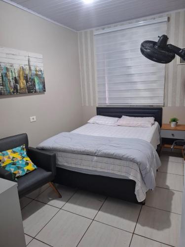 Кровать или кровати в номере Pousada Boutique em Guarulhos