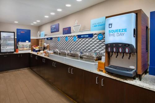 a store with a counter with aasteryasteryasteryasteryasteryasteryasteryasteryastery at Holiday Inn Express & Suites Eden Prairie - Minneapolis by IHG in Eden Prairie