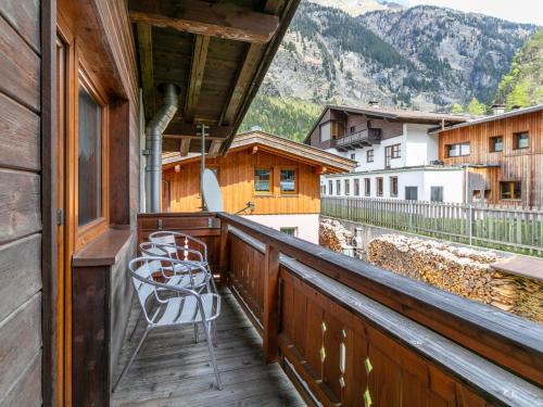 a chair sitting on a balcony with a view at Haus Joachim in Winkle