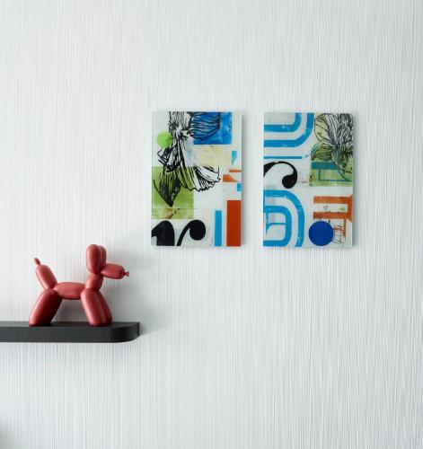 a shelf with a red toy and pictures on a wall at citizenM Seattle Pioneer Square in Seattle