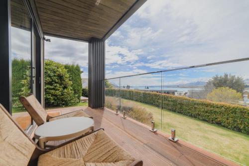 a balcony with a view of the water at Benmore Hideaway Cozy Room with Mini Kitchenette in Lake Tekapo