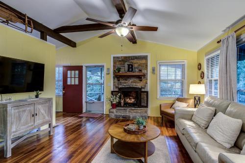 a living room with a couch and a fireplace at Mountain Home near Blue Ridge Parkway, Central Location! in Blowing Rock