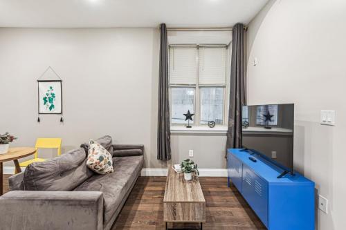 a living room with a couch and a table at Stay at Luna on Callowhill in Philadelphia