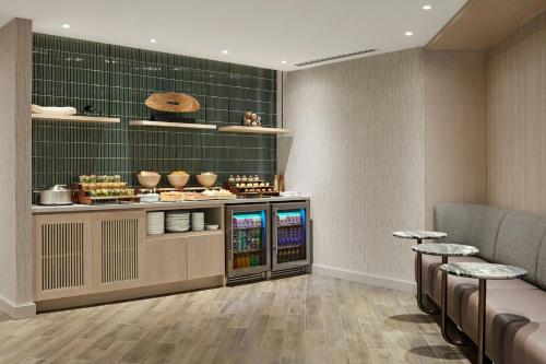 a restaurant with a counter with food on it at Halifax Marriott Harbourfront Hotel in Halifax