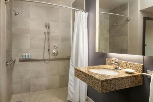 a bathroom with a sink and a shower at Residence Inn Anaheim Placentia/Fullerton in Placentia