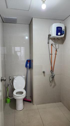 a bathroom with a toilet in a stall at Apartemen 2 Kamar Podomoro in Medan