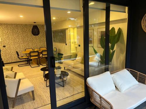 a living room with a couch and a table at Pucon Infinity Camino al Volcán in Pucón
