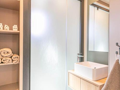 a bathroom with a white sink and a mirror at Chalet lumineux 4 pers à Aussois avec transats - FR-1-840-57 in Aussois
