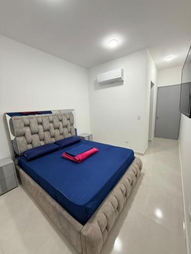 Katil atau katil-katil dalam bilik di Bonita casa en Cúcuta