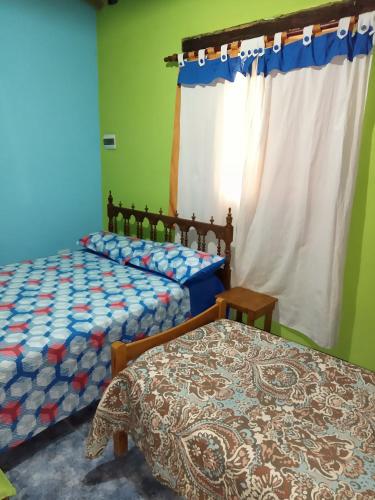 Katil atau katil-katil dalam bilik di Cabaña en Arroyo de los Patos