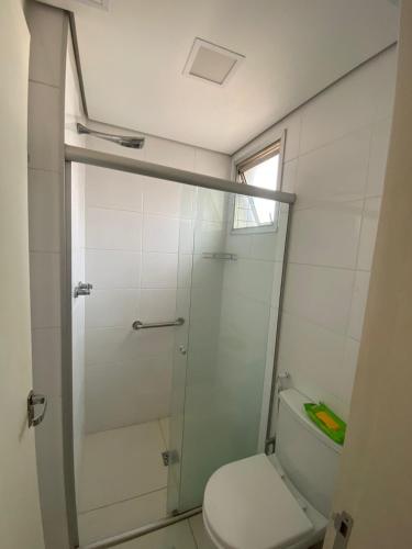 a bathroom with a toilet and a shower at Hotel Eldorado FLAT - AP Particular 1801 in Contagem
