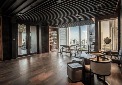 a living room with a view of a city at The Clan Hotel Singapore by Far East Hospitality in Singapore
