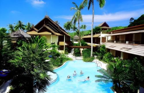 a group of people in a swimming pool at a resort at Phi Phi Banyan Villa in Phi Phi Don