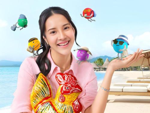 a woman sitting on the beach with birds on her back at Hotel Bintang Tawangmangu in Tawangmangu