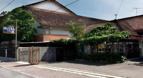 a building with a fence in front of it at Hotel Wijaya Magelang in Magelang