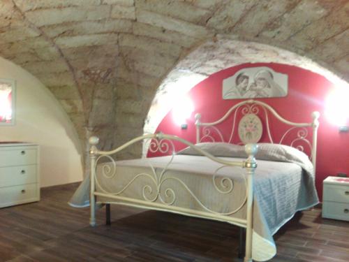 A bed or beds in a room at Casa della Nonna
